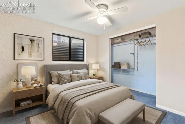 a bedroom with a large bed and a window