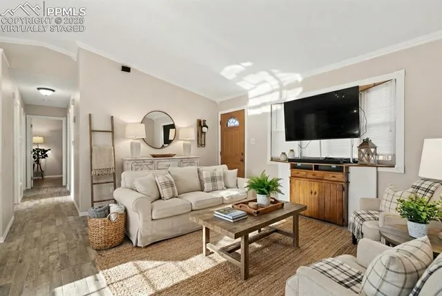 a living room with furniture and a flat screen tv