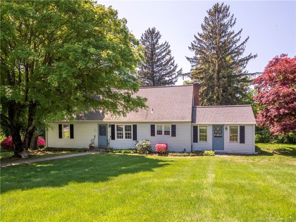 71 Stonecrest Road Ridgefield, CT 06877 - Photo 1 of 1 a view of a house with a swimming pool and a yard