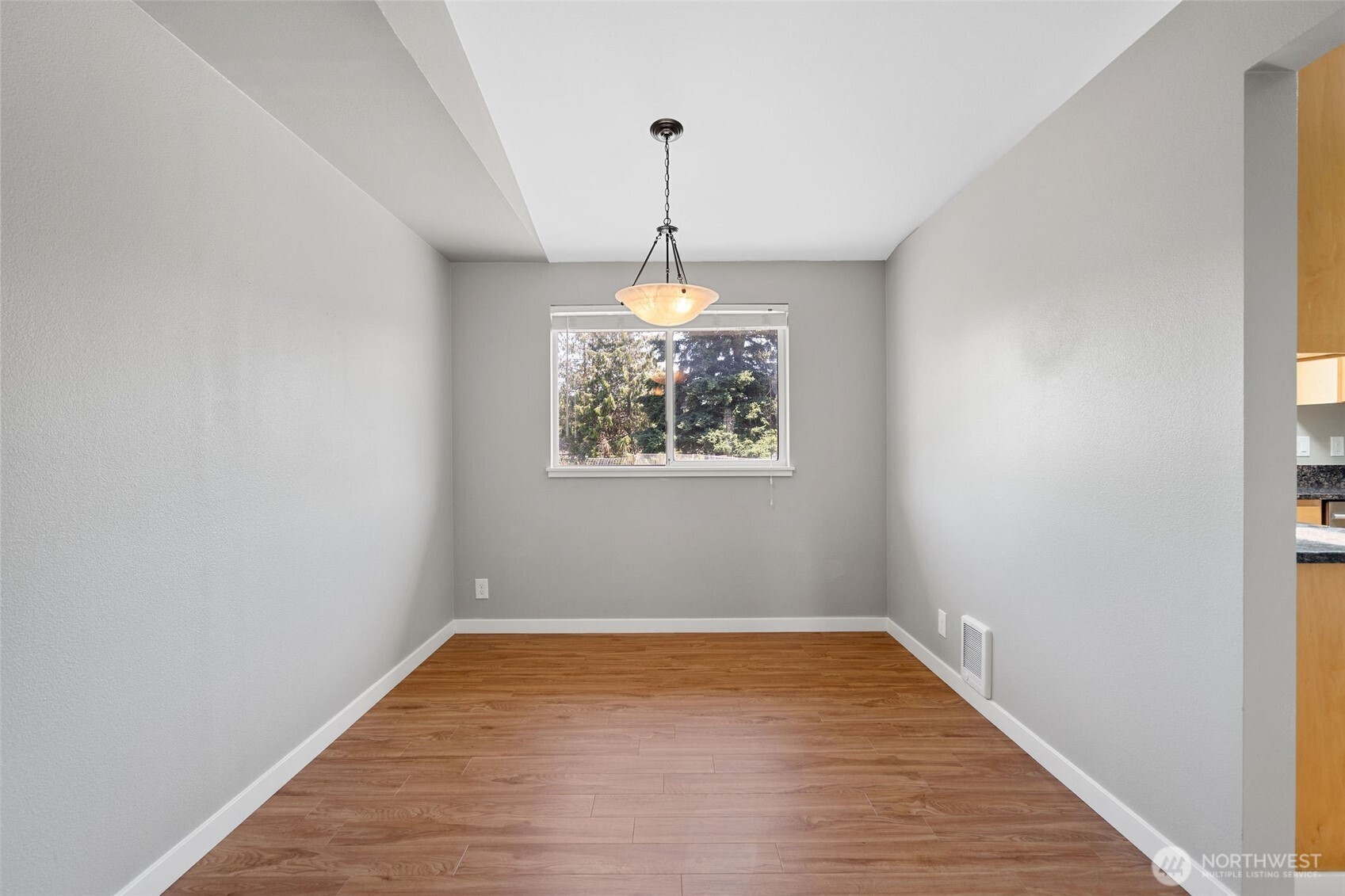 201 Schmid Street Enumclaw, WA 98022 - Photo 11 of 40 a very nice looking room with wooden floor a ceiling fan and window