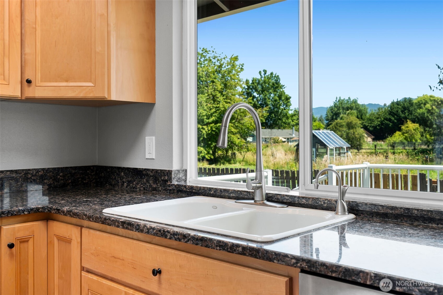 201 Schmid Street Enumclaw, WA 98022 - Photo 13 of 40 a kitchen with a sink and a large window