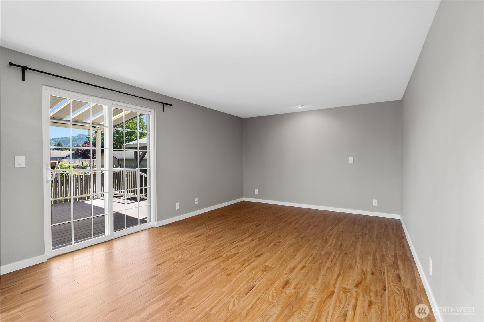 201 Schmid Street Enumclaw, WA 98022 - Photo 16 of 40 wooden floor in an empty room with a window