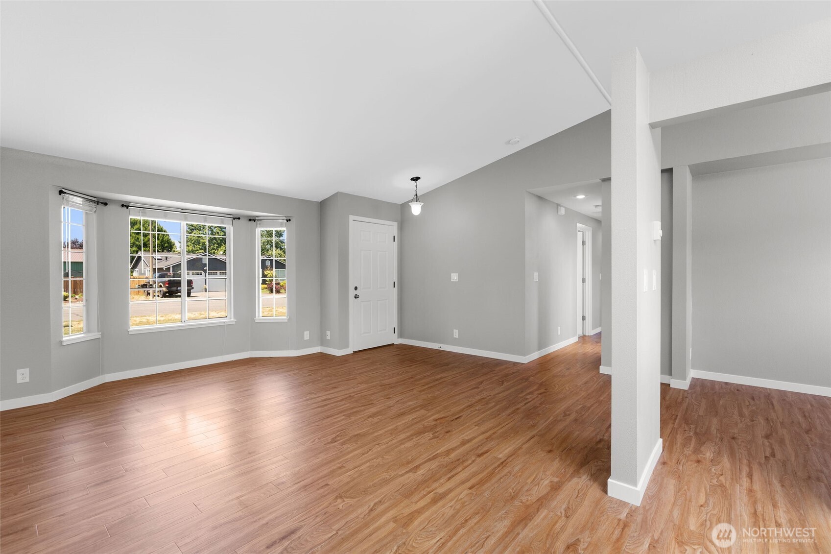201 Schmid Street Enumclaw, WA 98022 - Photo 18 of 40 an empty room with wooden floor and windows