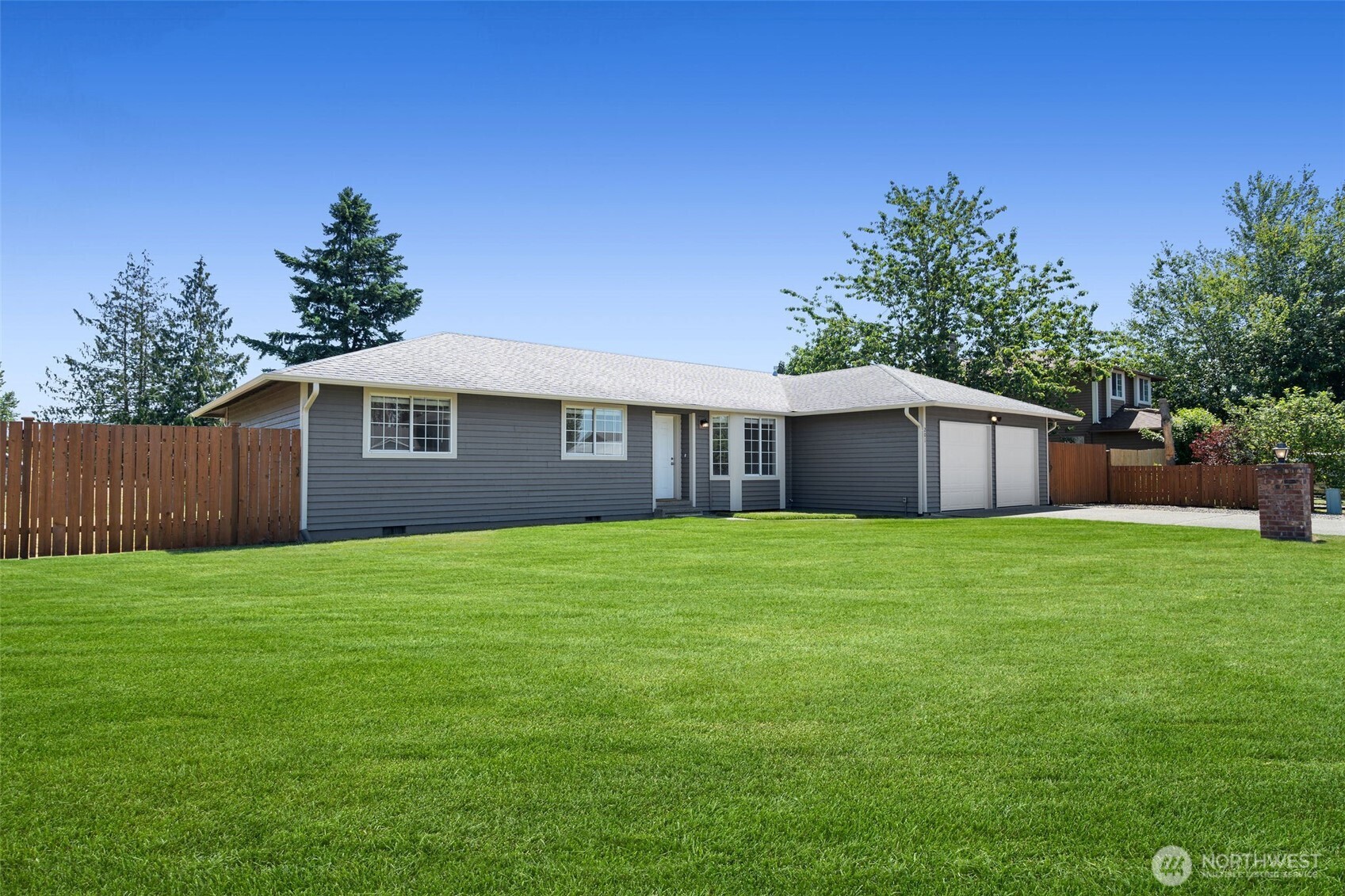 201 Schmid Street Enumclaw, WA 98022 - Photo 28 of 40 a front view of a house with a garden