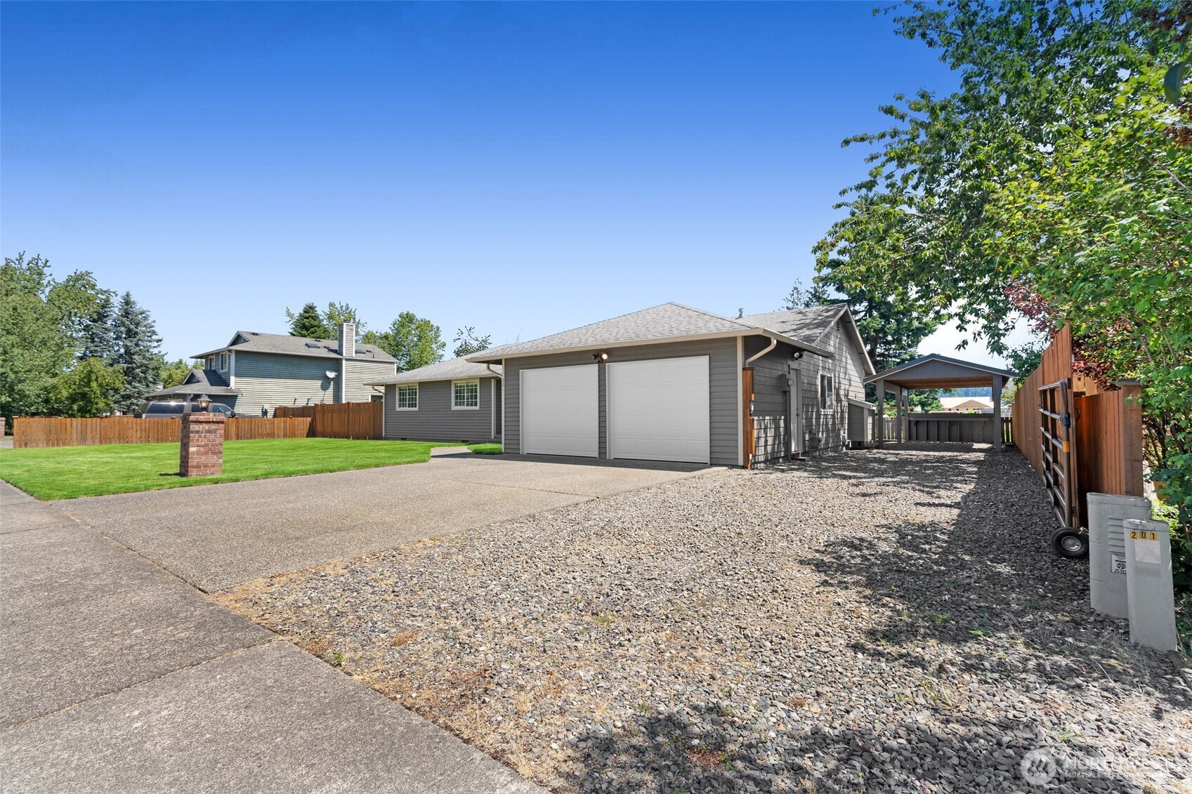 201 Schmid Street Enumclaw, WA 98022 - Photo 29 of 40 a front view of a house with a yard and garage