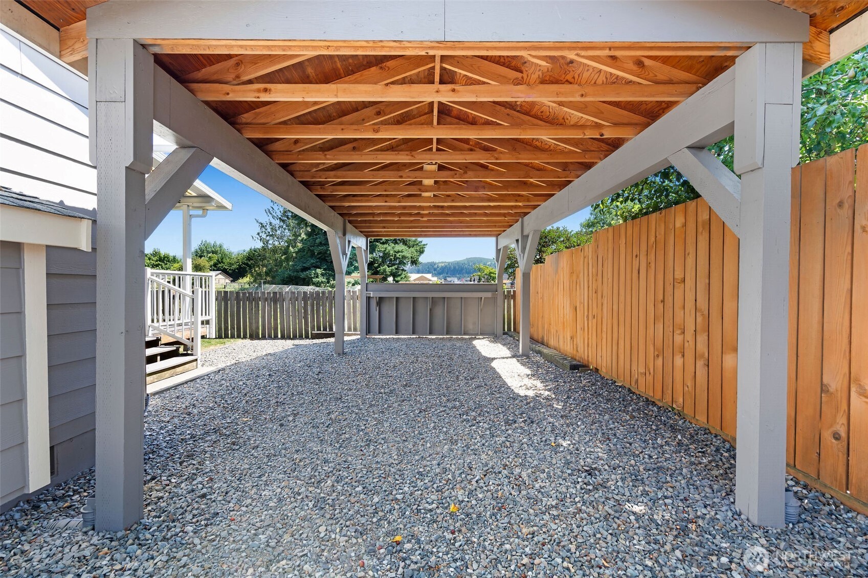 201 Schmid Street Enumclaw, WA 98022 - Photo 30 of 40 a view of backyard with small cabin and wooden fence