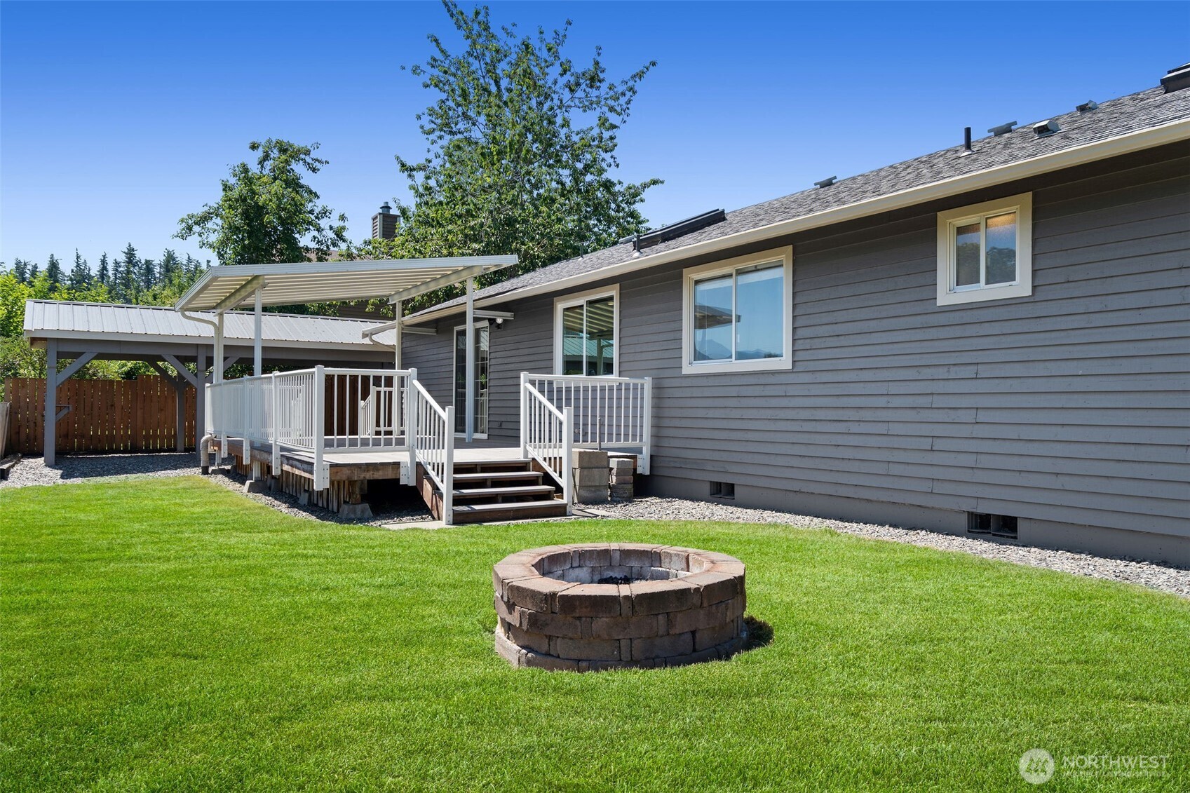 201 Schmid Street Enumclaw, WA 98022 - Photo 35 of 40 a view of a house with a yard porch and sitting area