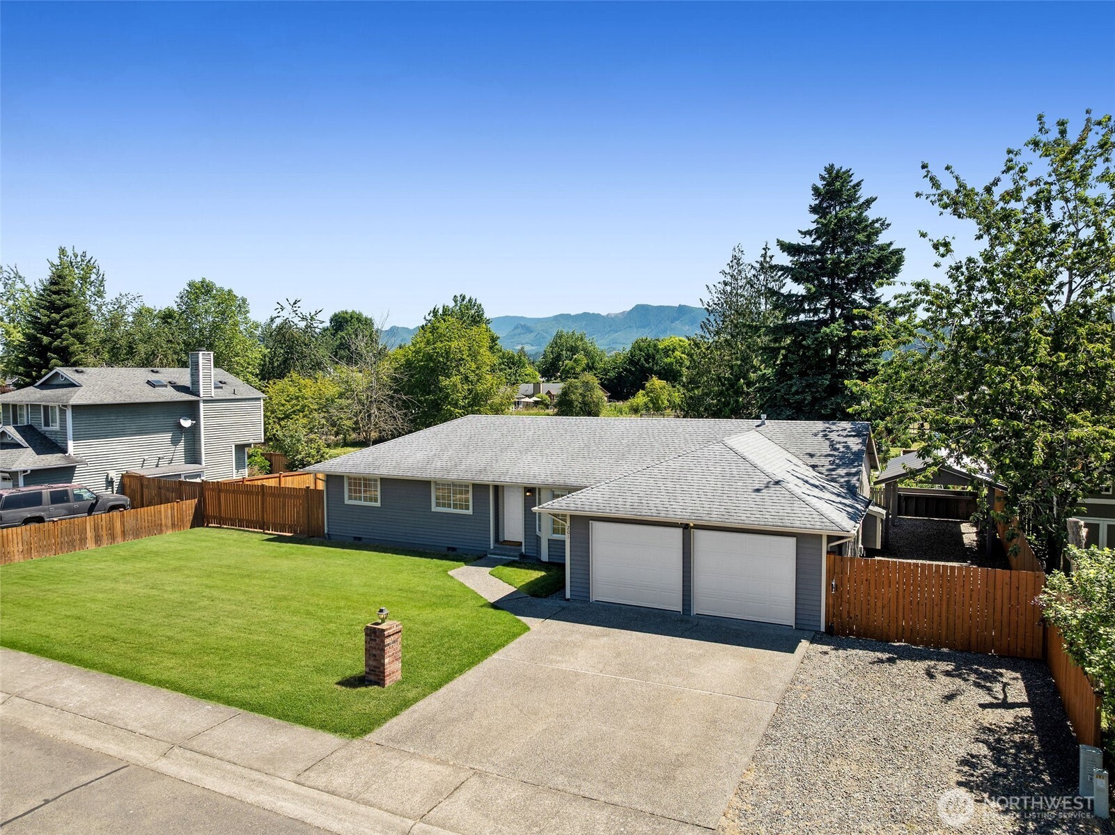 201 Schmid Street Enumclaw, WA 98022 - Photo 4 of 40 a view of a house with garden