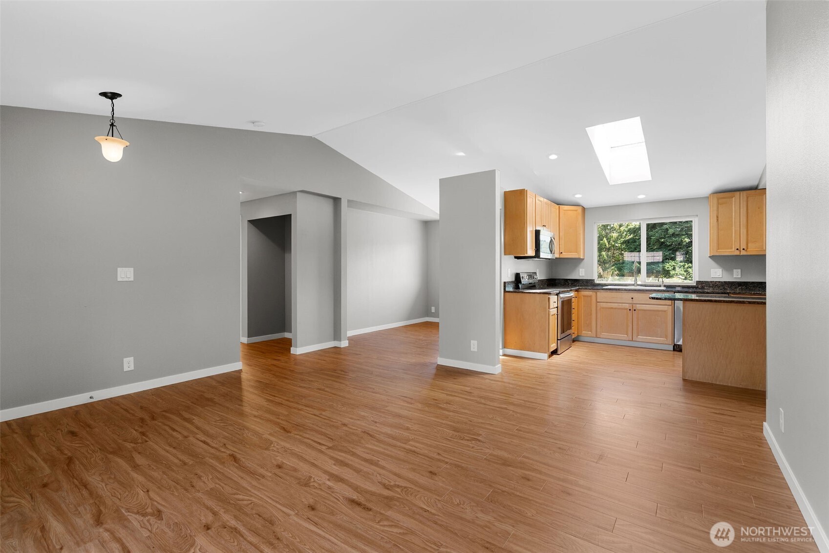 201 Schmid Street Enumclaw, WA 98022 - Photo 10 of 40 a view of a kitchen with a sink stove cabinets and empty room