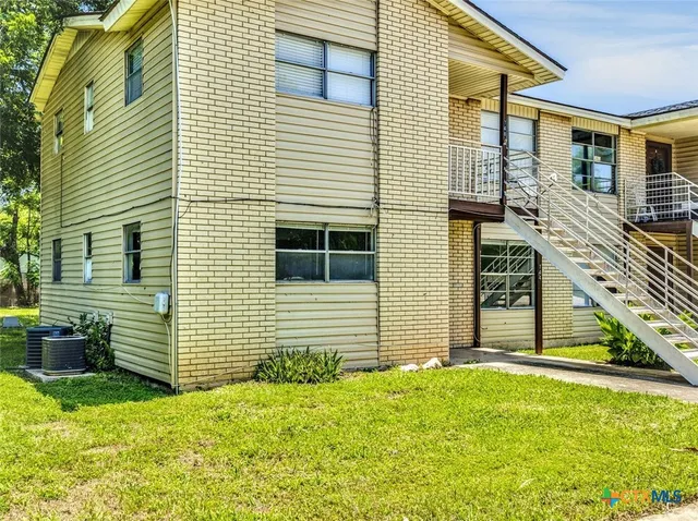 a view of a house with many windows