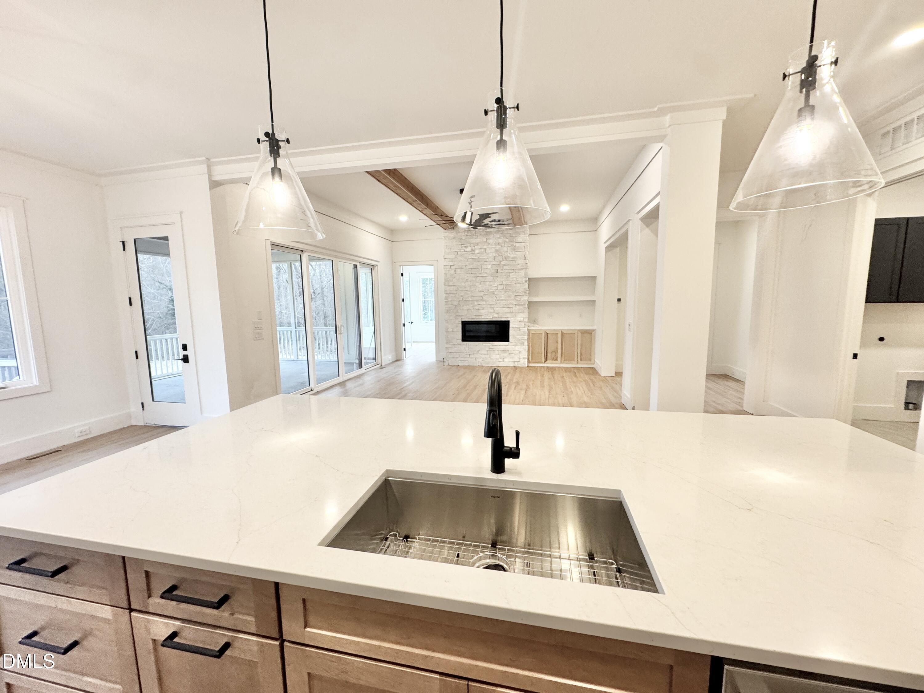 8012 Penny Road Raleigh, NC 27606 - Photo 20 of 83 a view of a kitchen with a sink and chandelier