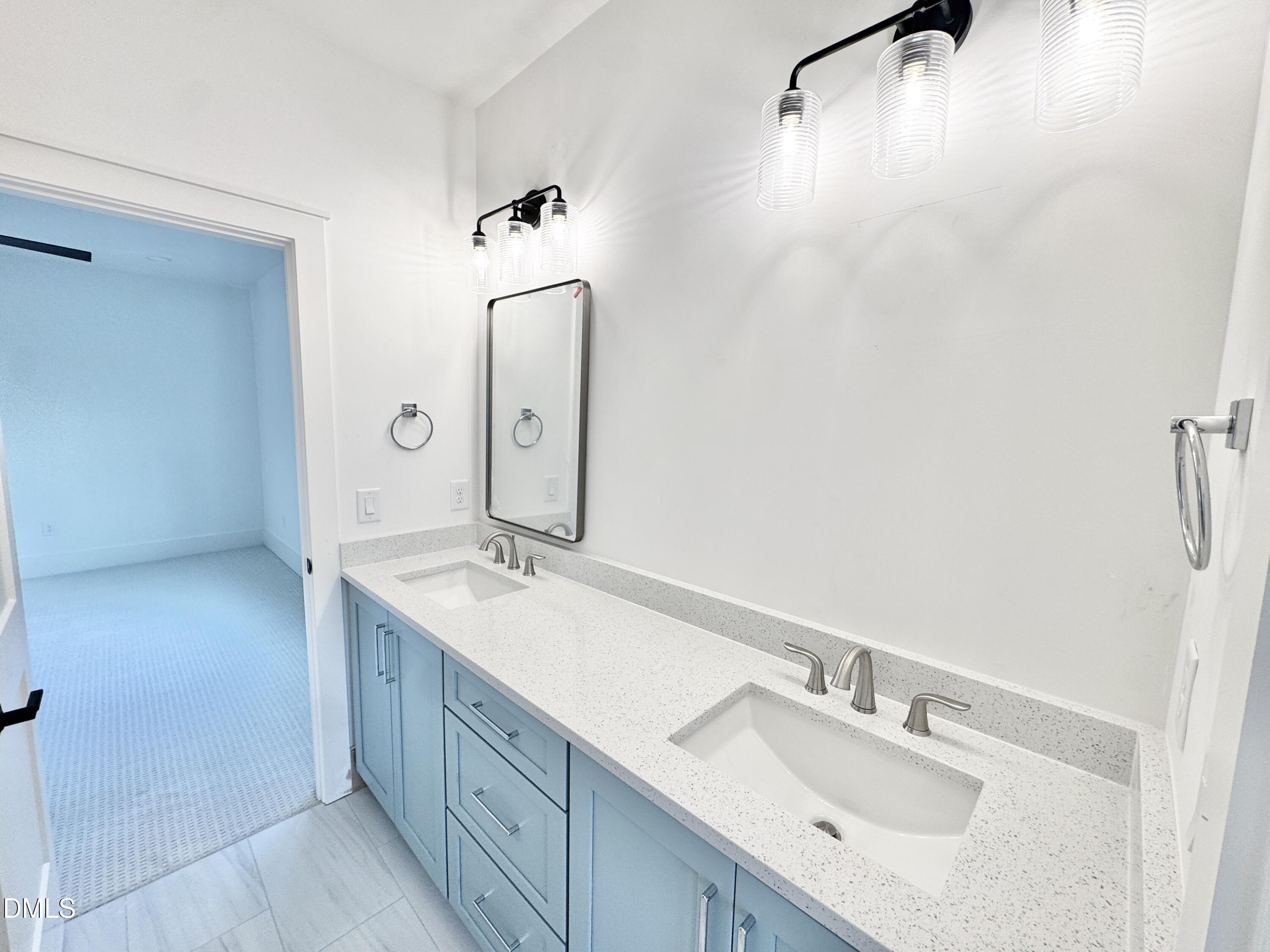 8012 Penny Road Raleigh, NC 27606 - Photo 43 of 83 a bathroom with a sink and a mirror