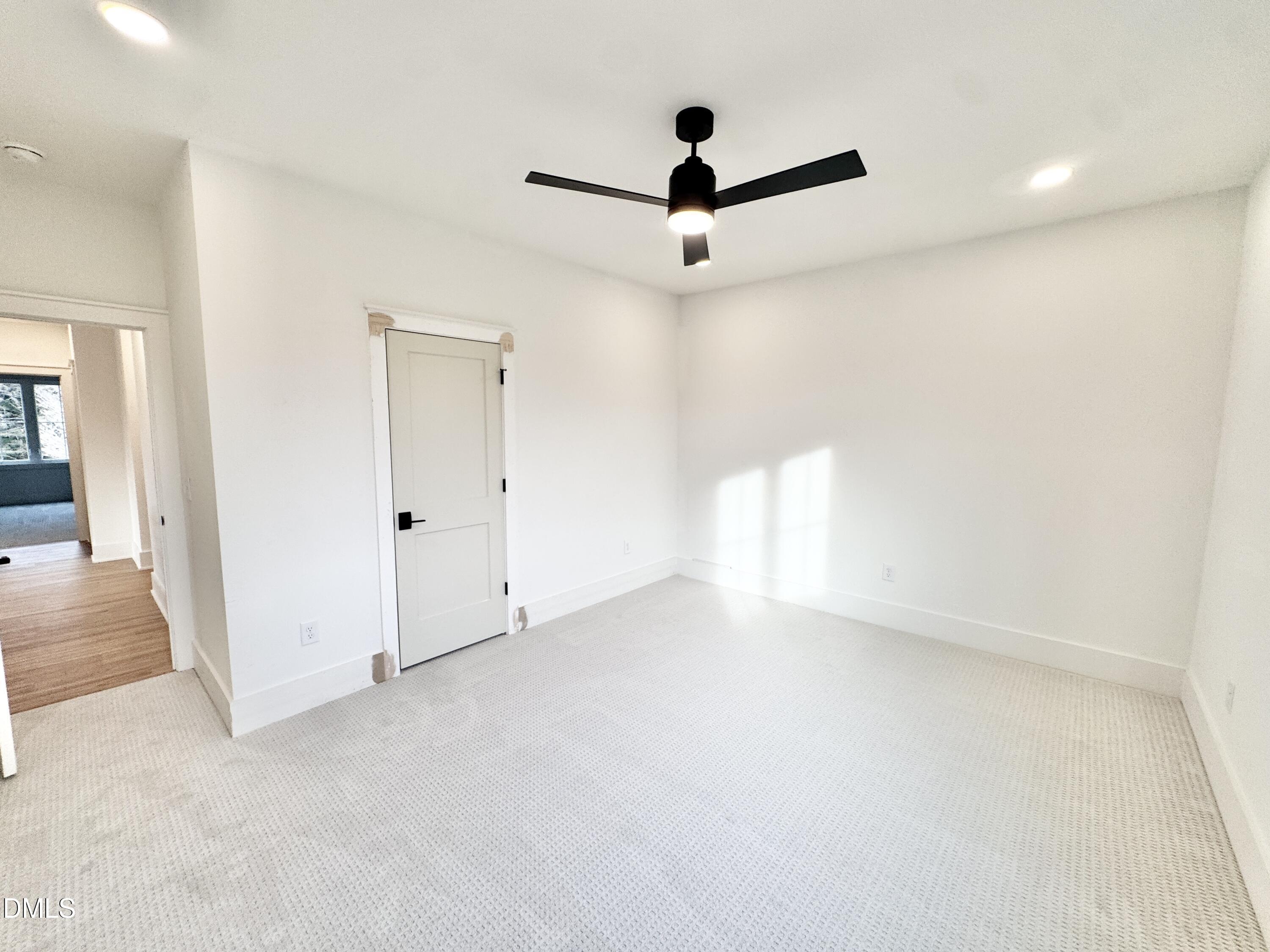8012 Penny Road Raleigh, NC 27606 - Photo 47 of 83 an empty room with a ceiling fan and window
