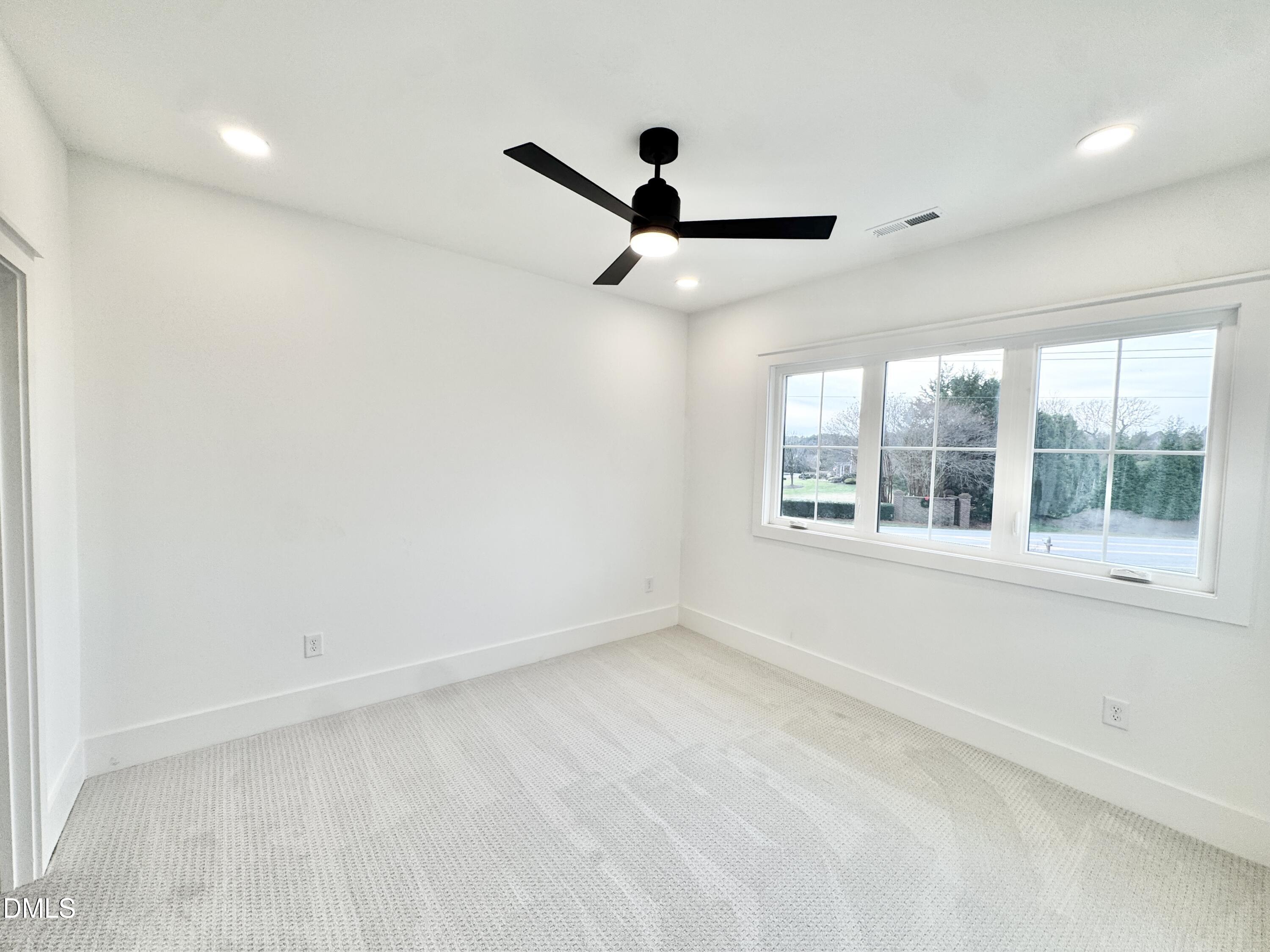 8012 Penny Road Raleigh, NC 27606 - Photo 48 of 83 a view of an empty room with a window