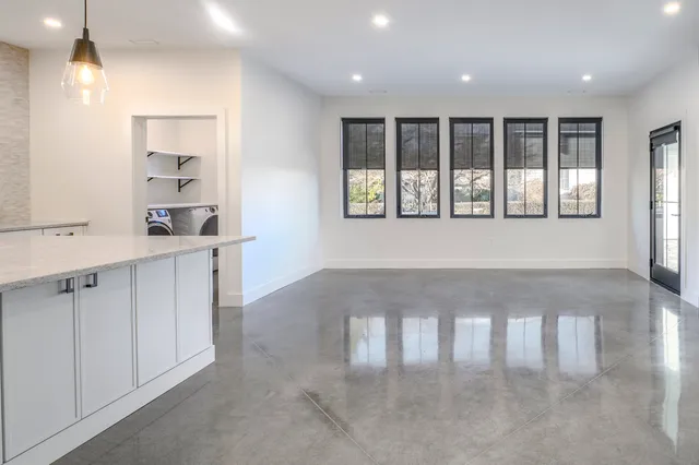 a view of an empty room with a window