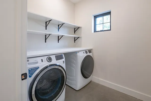 a utility room with dryer and washer