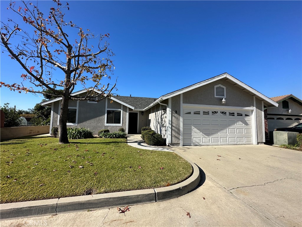 700 West 2nd Street, Unit 3 Azusa, CA 91702 - Photo 1 of 17 a front view of a house with garden