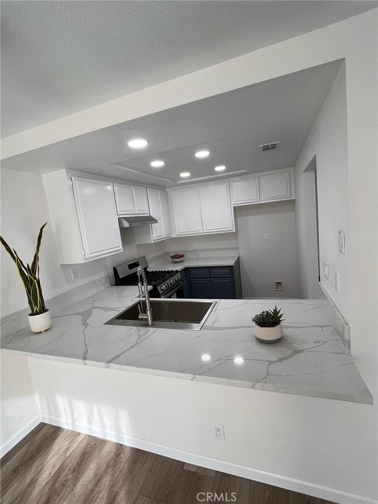 700 West 2nd Street, Unit 3 Azusa, CA 91702 - Photo 3 of 17 a kitchen with a sink appliances and cabinets