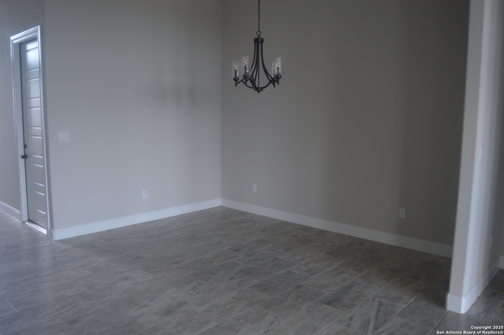 153 West Medium Meadow Drive Lytle, TX 78052 - Photo 11 of 26 a view of a room with wooden floor and fan