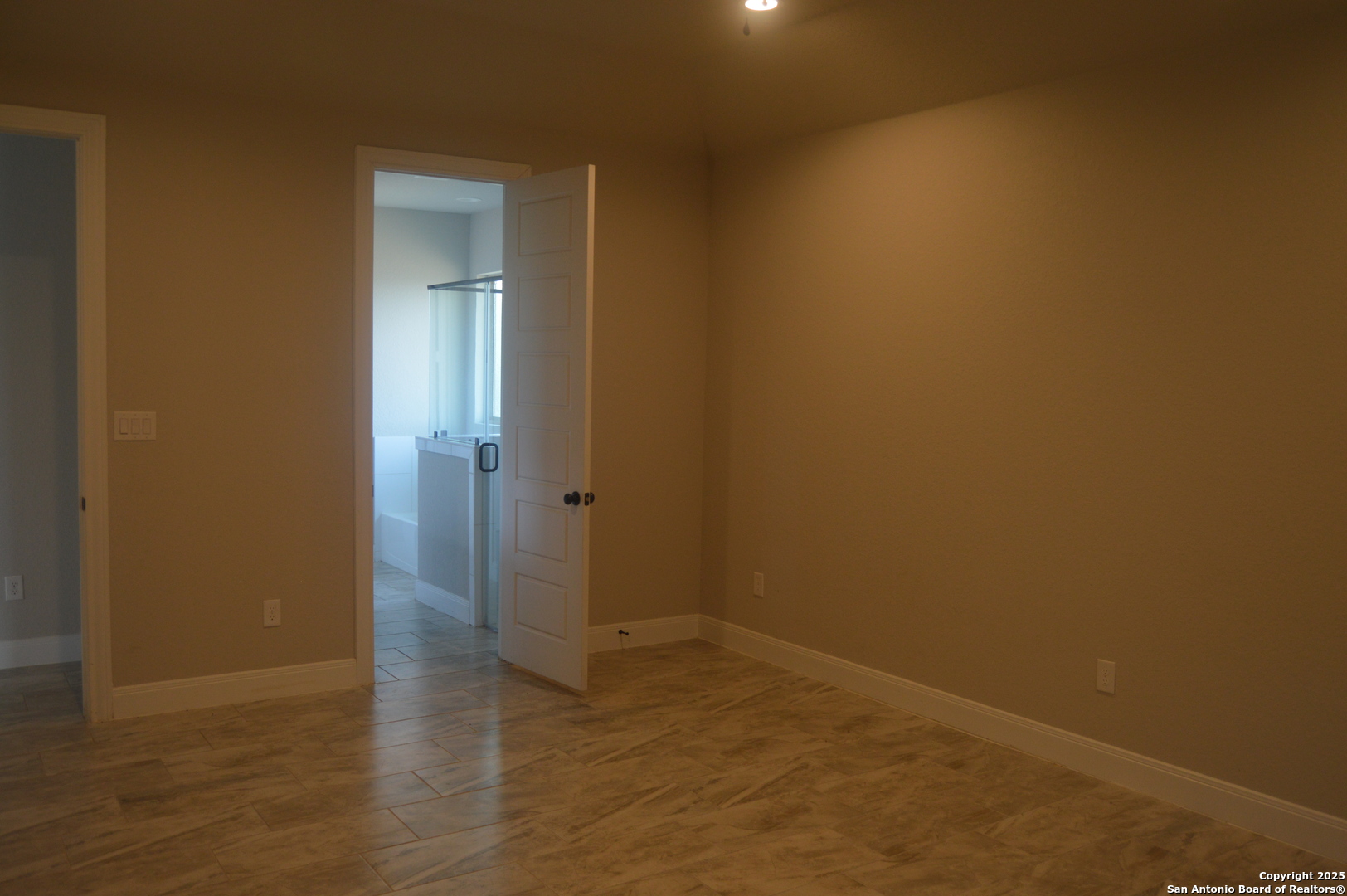 153 West Medium Meadow Drive Lytle, TX 78052 - Photo 12 of 26 an empty room with wooden floor and closet