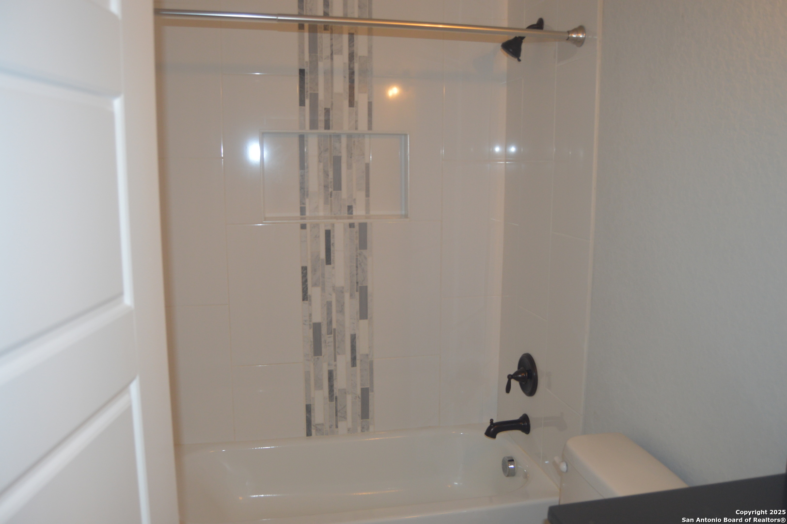 153 West Medium Meadow Drive Lytle, TX 78052 - Photo 24 of 26 a bathroom with a bathtub and a shower