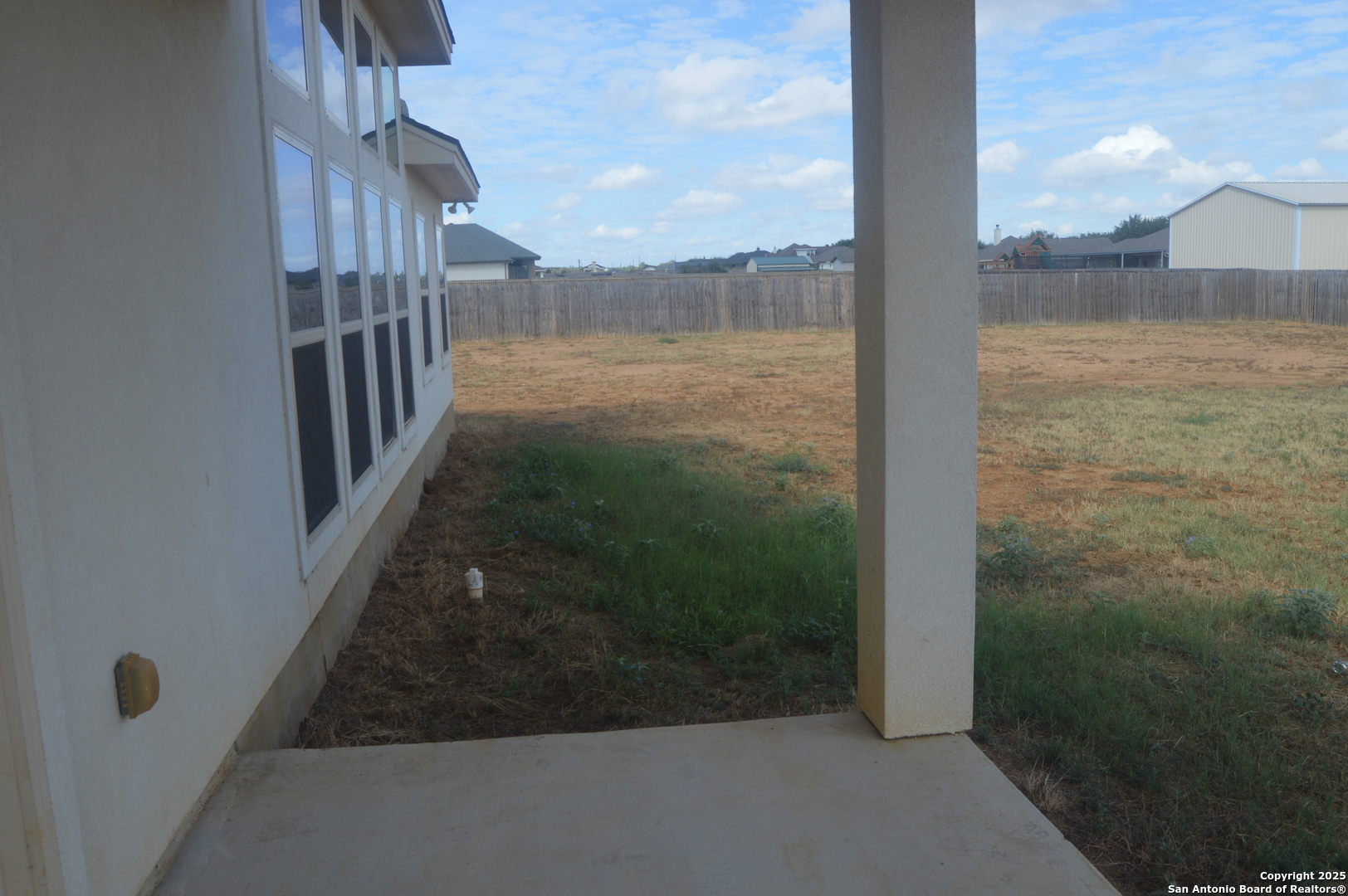 153 West Medium Meadow Drive Lytle, TX 78052 - Photo 25 of 26 a view of a glass door and porch