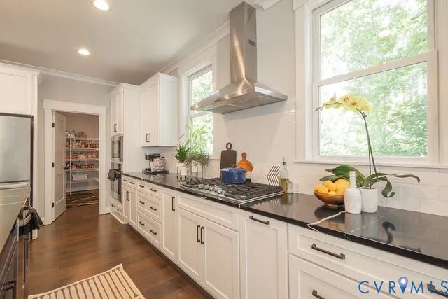 a kitchen with sink and window