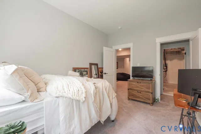 a bathroom with a sink a toilet a mirror and shower curtain