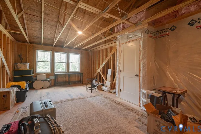 a view of balcony with wooden floor and barbeque oven