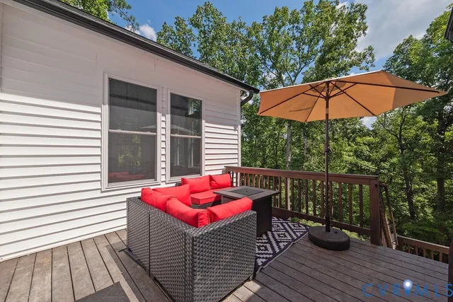 a view of a two chairs in the balcony