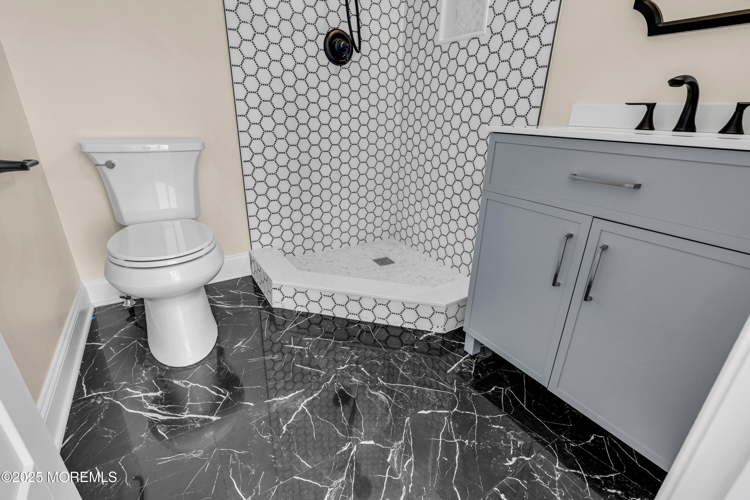 1900 Main Street Belmar, NJ 07719 - Photo 17 of 20 a bathroom with a toilet sink and mirror