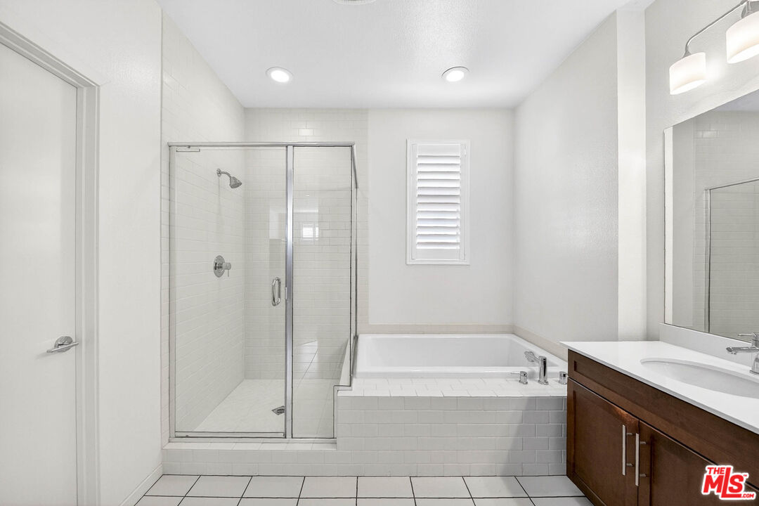707 Colorado Circle Carson, CA 90745 - Photo 15 of 40 a bathroom with a bathtub a shower and a sink