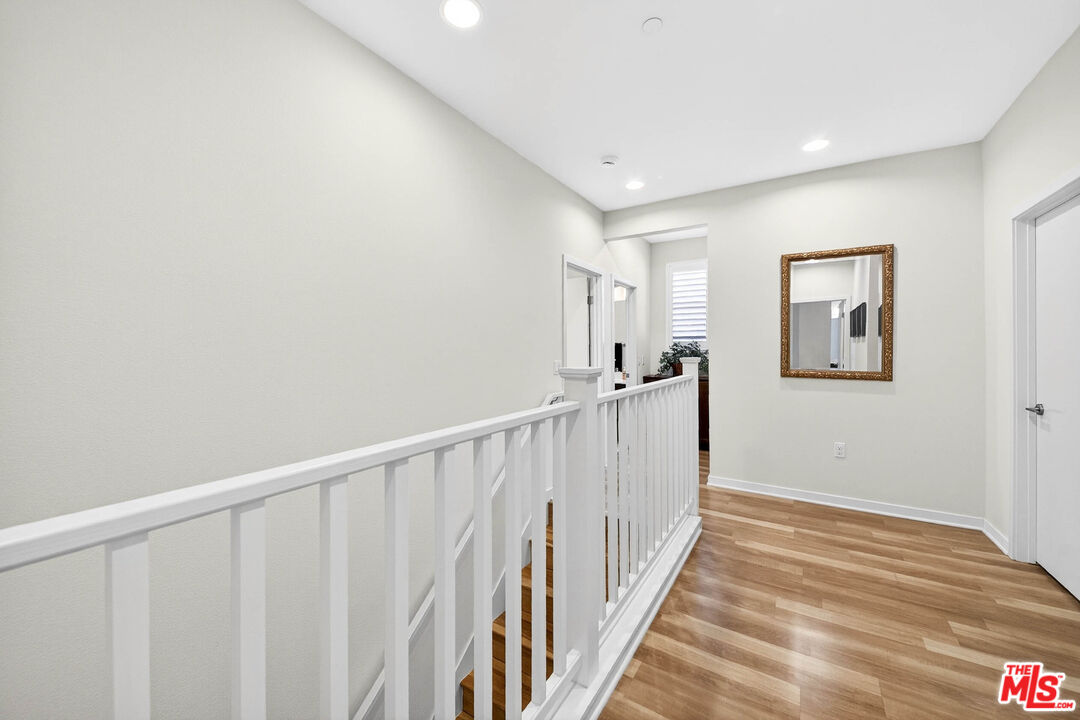 707 Colorado Circle Carson, CA 90745 - Photo 16 of 40 a view of a hallway with wooden floor and closet