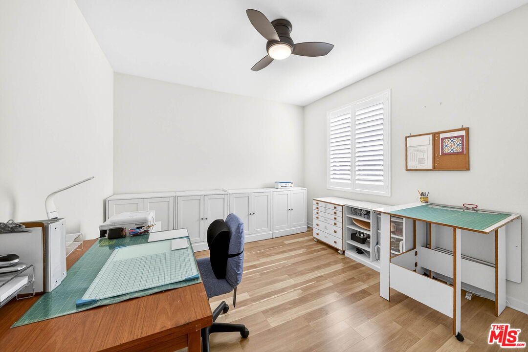 707 Colorado Circle Carson, CA 90745 - Photo 18 of 40 a view of a workspace with furniture and a window