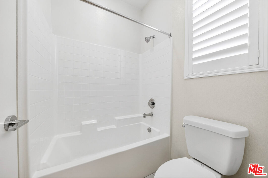 707 Colorado Circle Carson, CA 90745 - Photo 20 of 40 a white toilet sitting next to a bath tub
