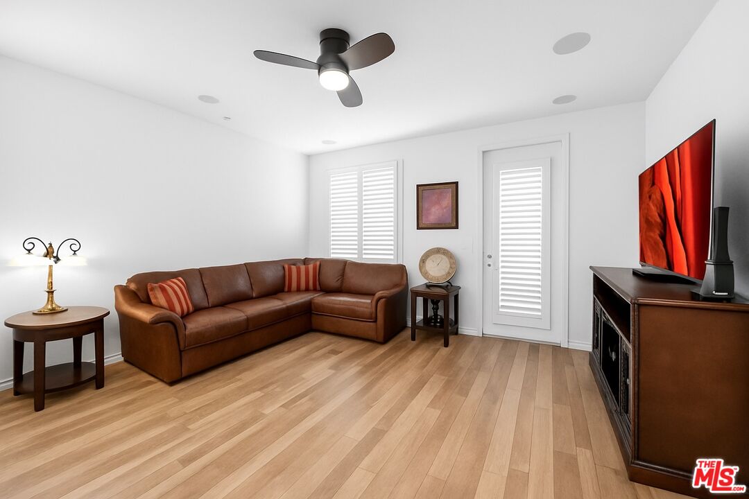 707 Colorado Circle Carson, CA 90745 - Photo 2 of 40 a living room with furniture a flat screen tv and a fireplace
