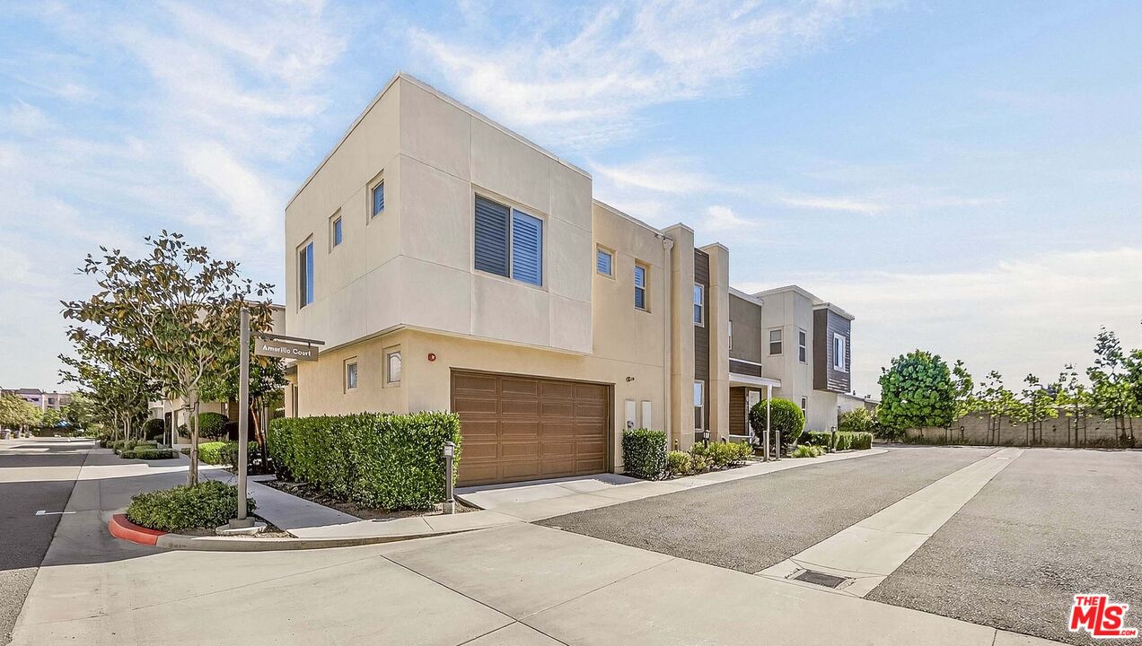 707 Colorado Circle Carson, CA 90745 - Photo 24 of 40 a front view of a house with a yard and garage