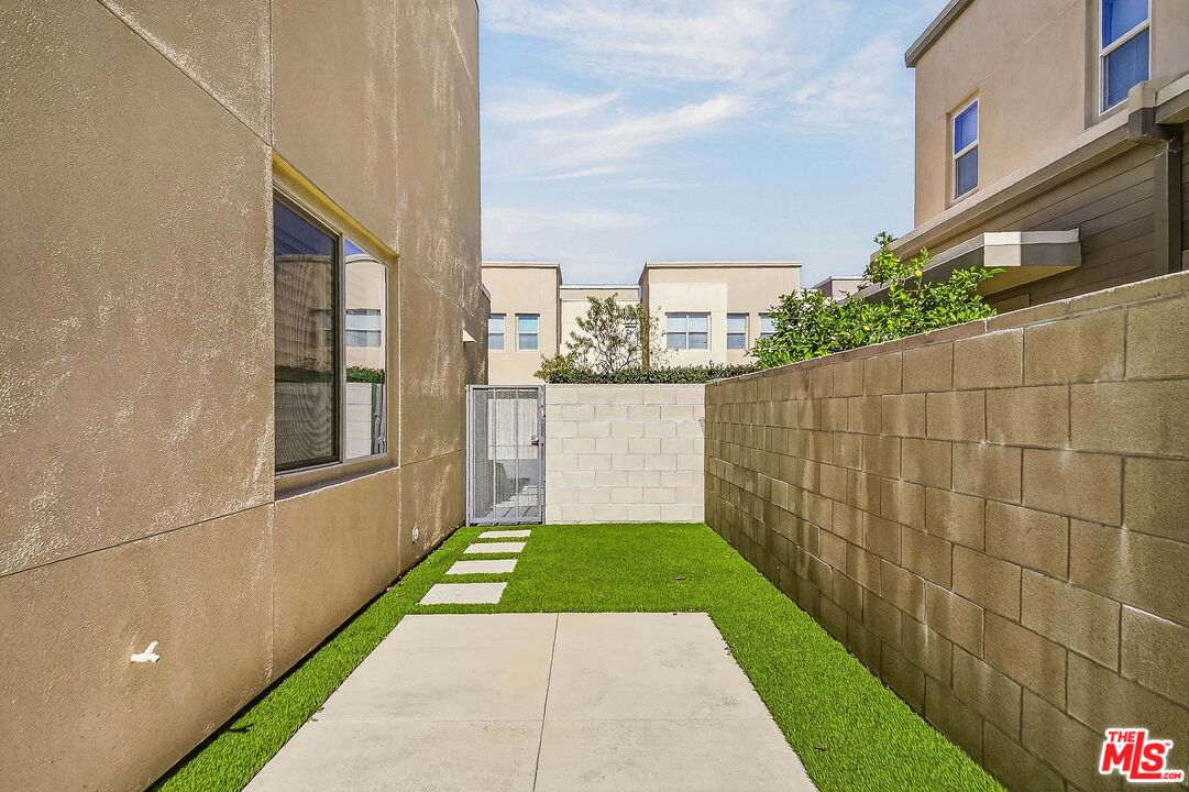 707 Colorado Circle Carson, CA 90745 - Photo 26 of 40 a view of a pathway both side of a building