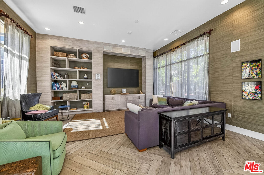707 Colorado Circle Carson, CA 90745 - Photo 36 of 40 a living room with furniture and a flat screen tv