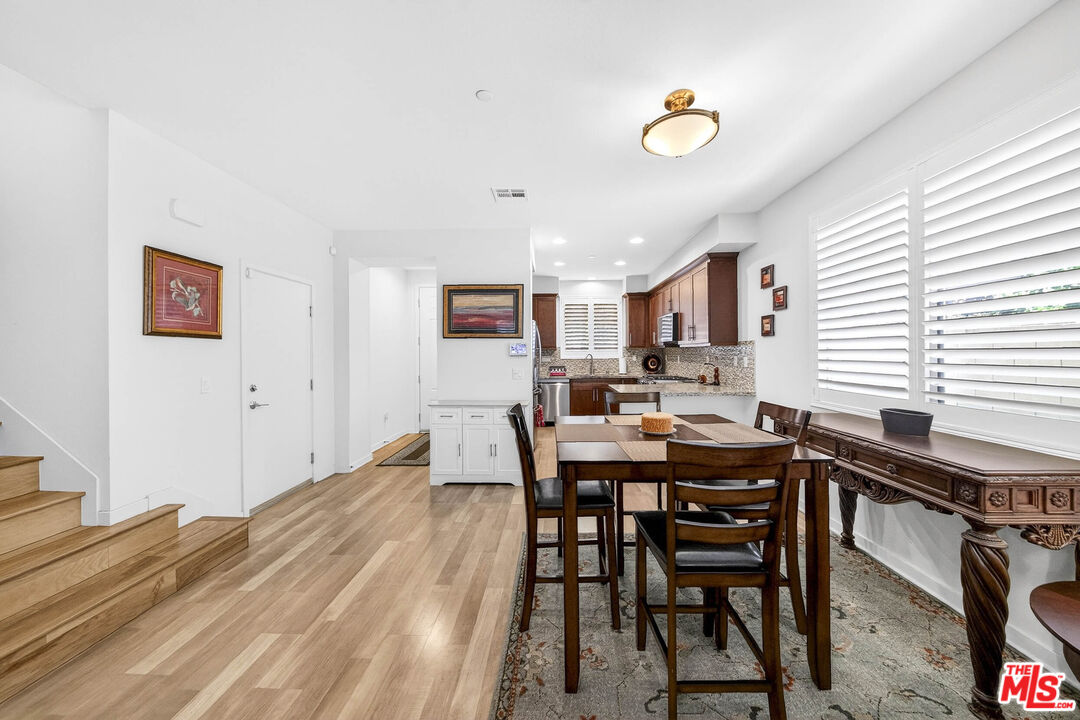 707 Colorado Circle Carson, CA 90745 - Photo 7 of 40 a view of a dining room with furniture and a window