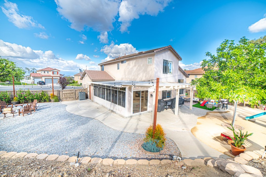17801 Morning Rock Circle Riverside, CA 92503 - Photo 7 of 18 a view of a house with a patio