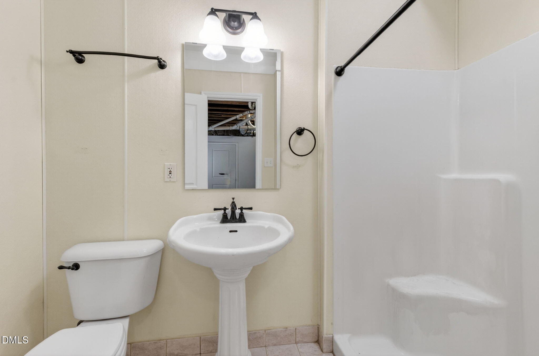 1224 Pineview Drive Raleigh, NC 27606 - Photo 29 of 45 a bathroom with a sink toilet and mirror