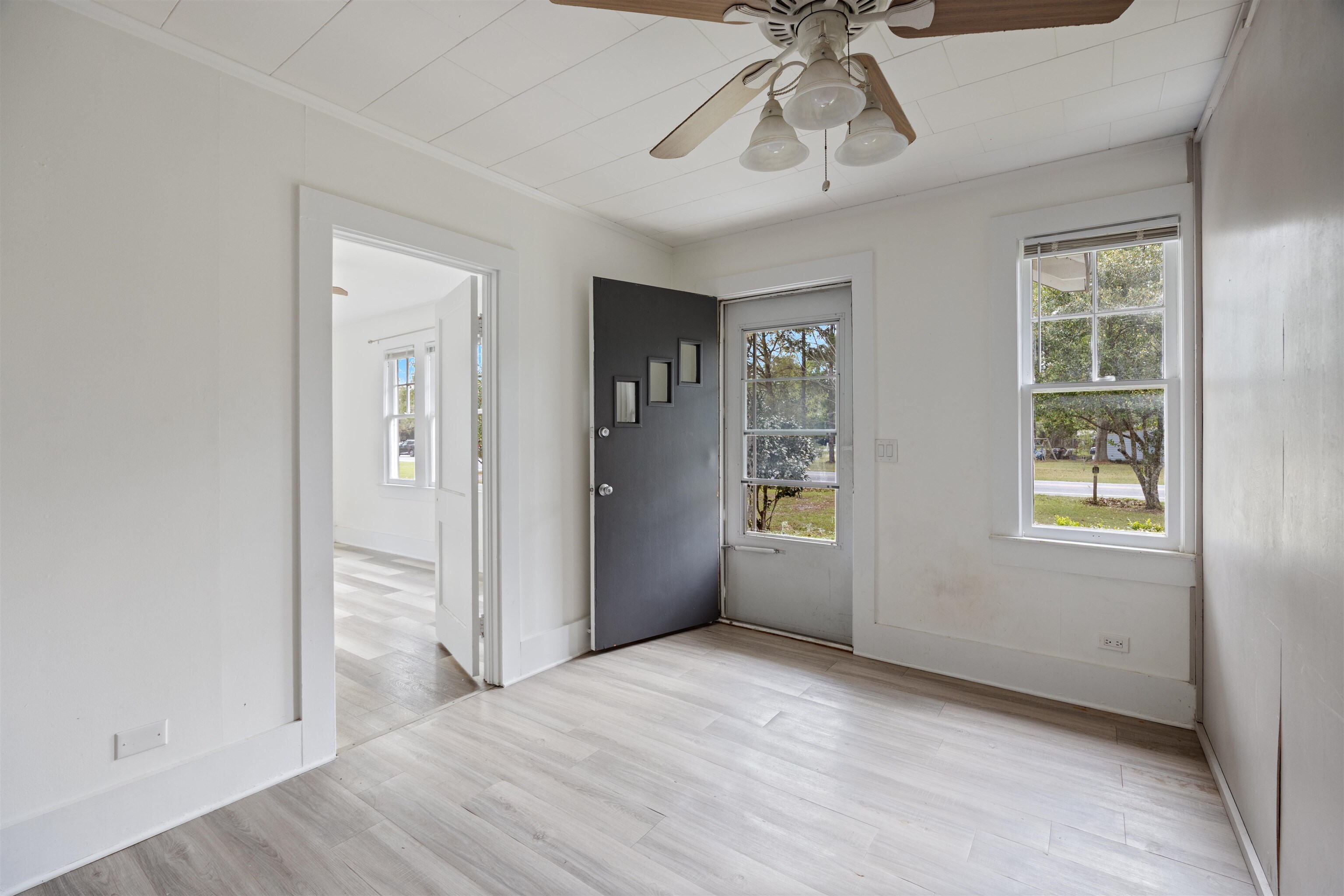 112 South Juniper Street Foley, AL 36535 - Photo 42 of 64 Entrance foyer featuring a ceiling fan, light wood finished floors, and crown molding