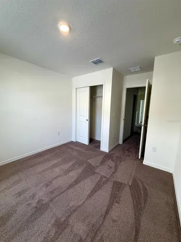 a view of a big room with closet and bathroom