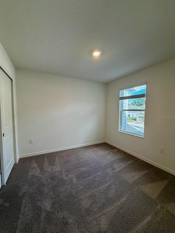 2787 Raindrop Run Street Clermont, FL 34714 - Photo 12 of 18 an empty room with windows