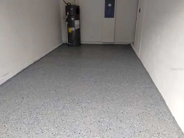 a view of a swimming pool with a patio and a yard