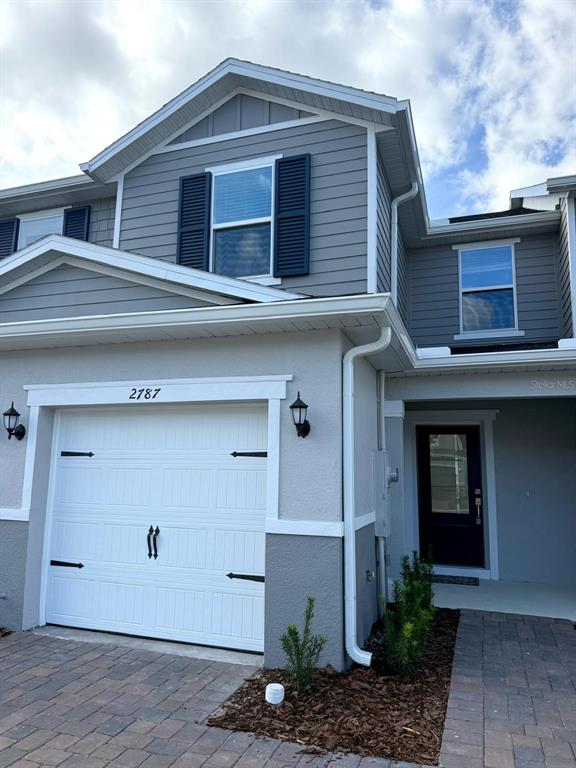 2787 Raindrop Run Street Clermont, FL 34714 - Photo 2 of 18 a front view of a house