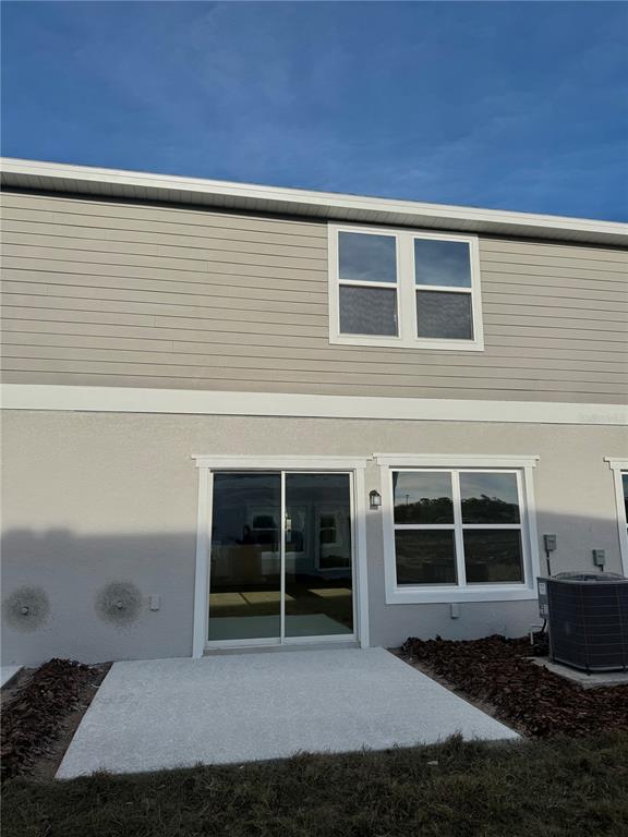 2787 Raindrop Run Street Clermont, FL 34714 - Photo 7 of 18 a house with trees in the background