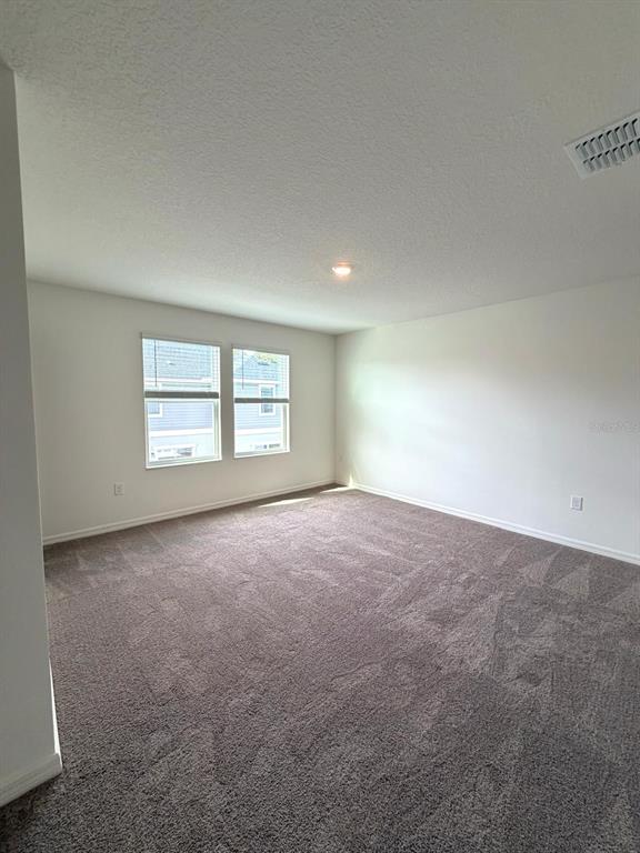 2787 Raindrop Run Street Clermont, FL 34714 - Photo 9 of 18 an empty room with a window