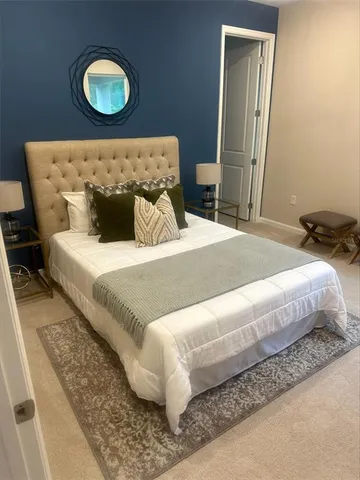 a bedroom with a bed and a sink